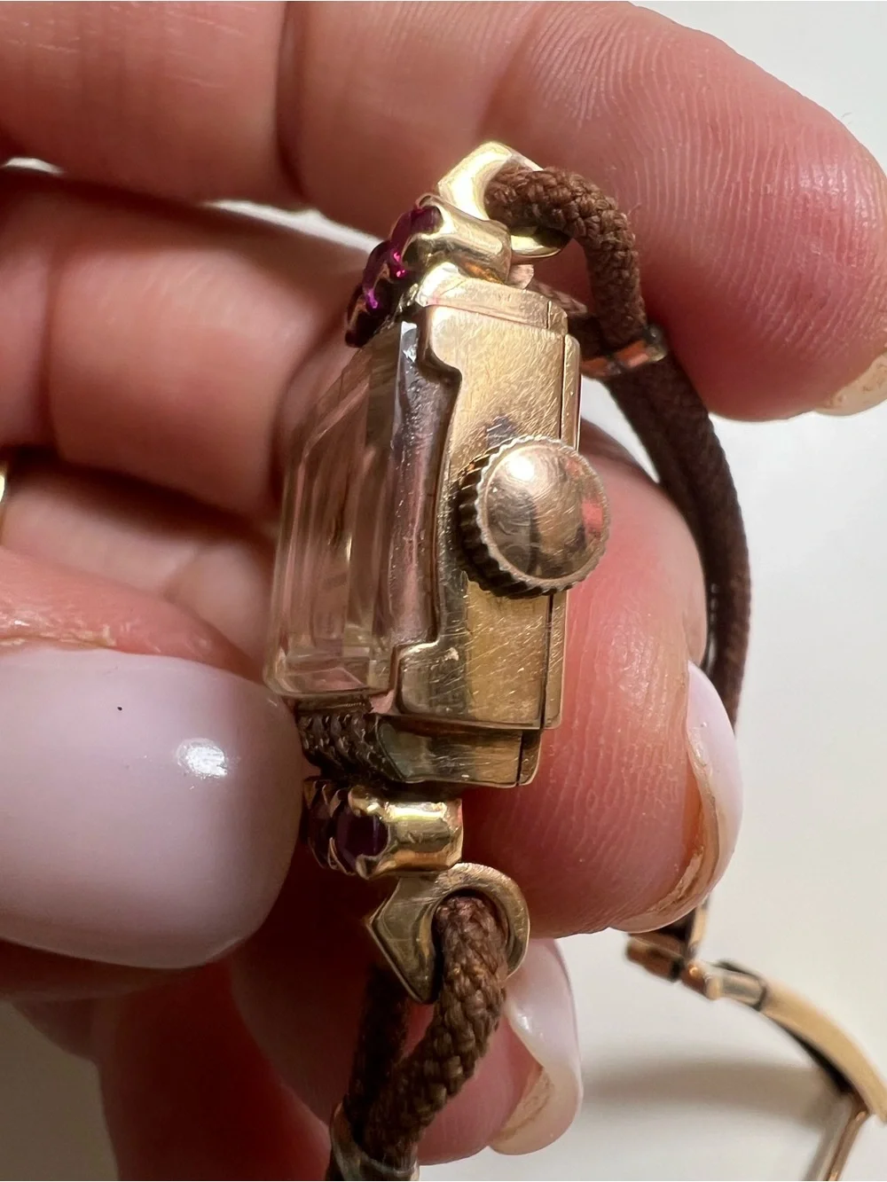 Gruen Precision wristwatch crafted in 14k rose gold with rubies and diamonds